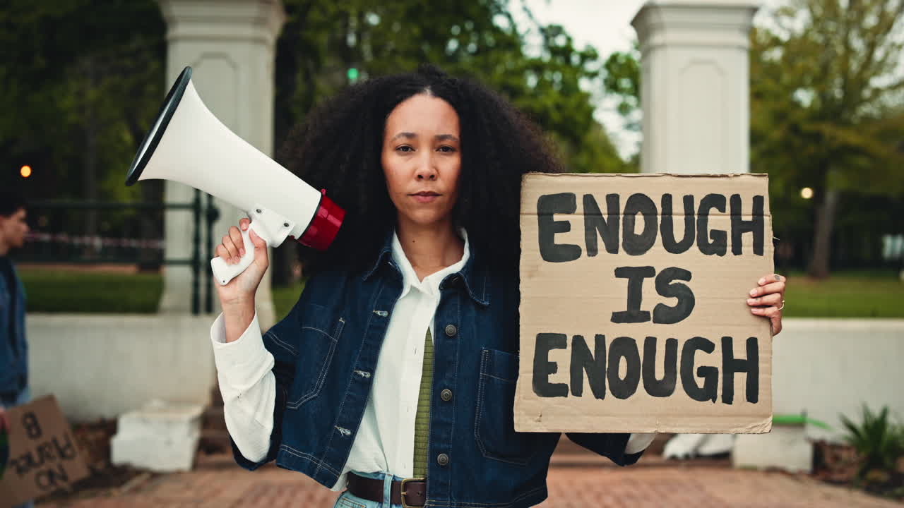 Activist Woman Holds Megaphone and 'Enough Is Enough' Protest Sign