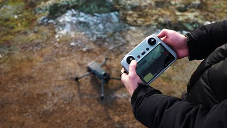 Person-make-remote-control-joystick-combination-and-activate-drone-propellers