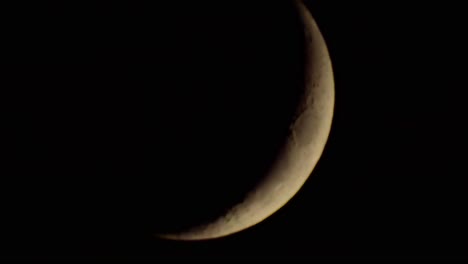 dark dramatic glowing moon with fast moody clouds stormy passing across