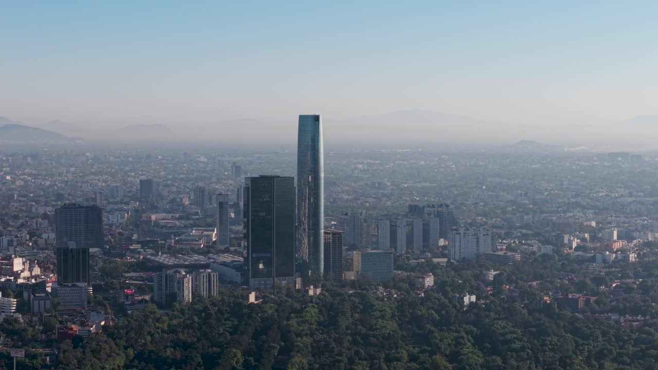 Drone footage of skyscrapers in southern Mexico City, showing city shrouded in smog