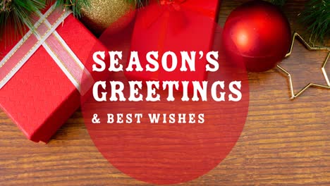 animation of seasons greetings and best wishes in circle over christmas decorations in background