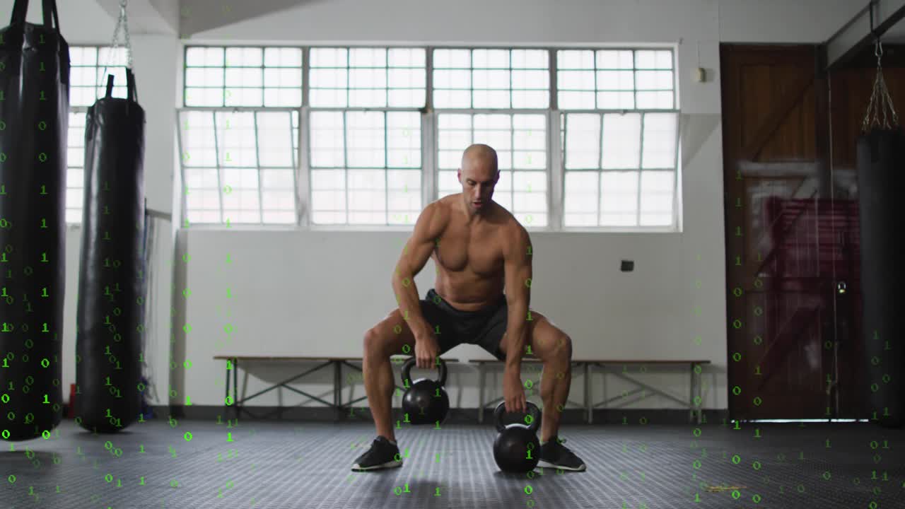 Man from wide squat alternating kettlebell cleans in gym training fitness green overlay behind him