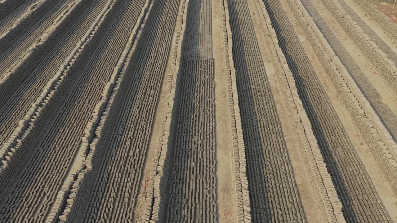 Drone footage of bricks drying at brick factory in Bangladesh