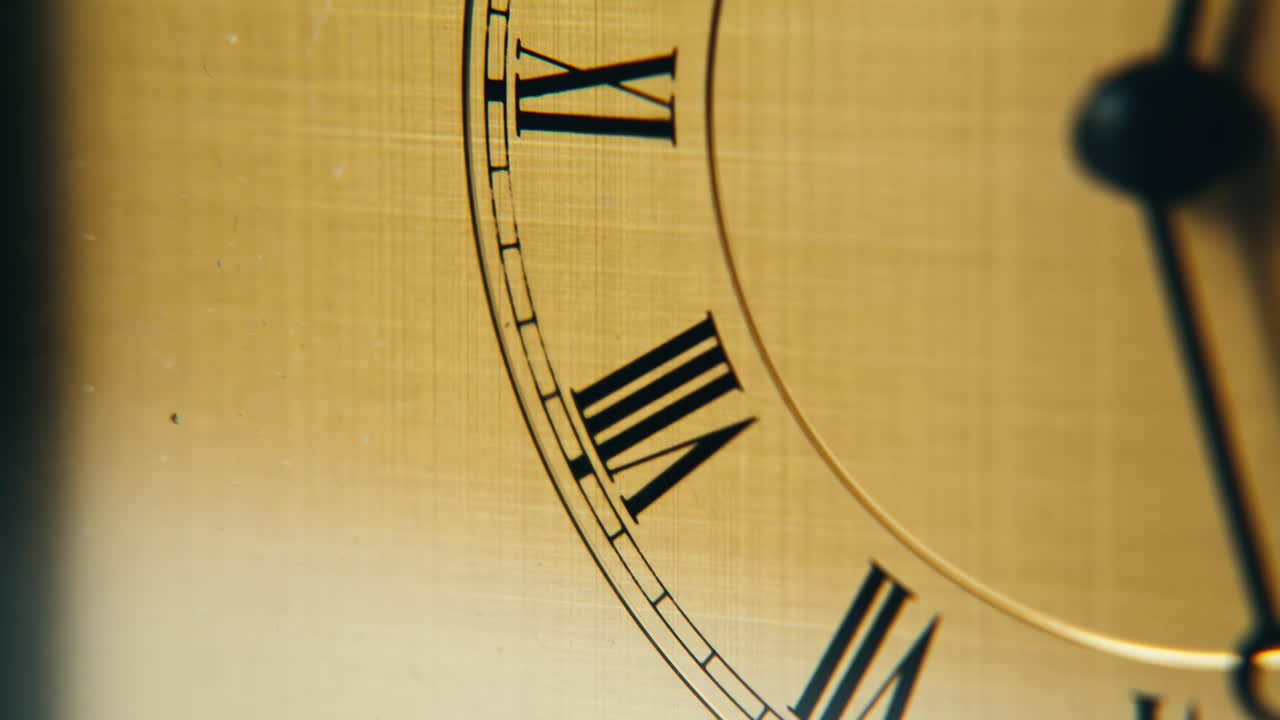 Elegant timepiece marking hour indoors with black hand. Closeup antique detail