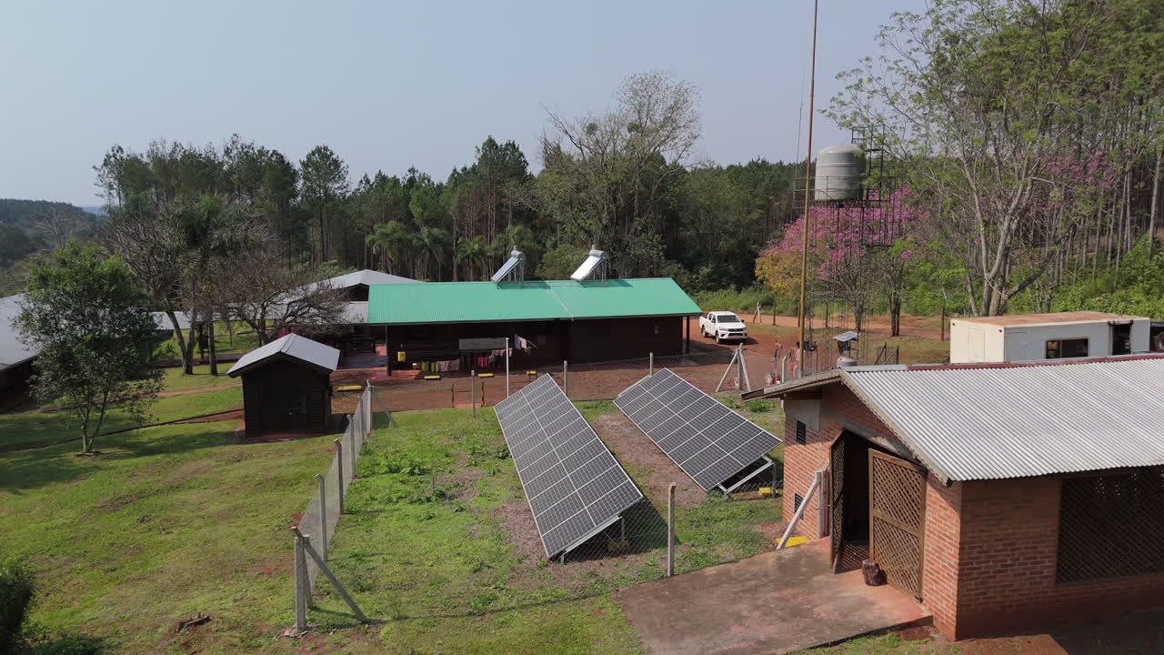 Sustainable rural farm with solar panels and eco friendly structures, Aerial view