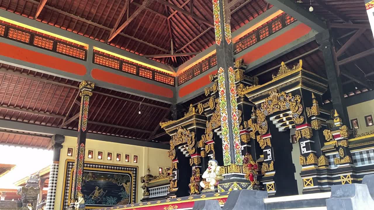 Tana Lot Temple with Golden Artistic Mosaic Decor Inside the Religious Realm in Bali, Indonesia.