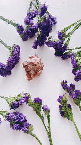 purple flowers and crystal arrangement