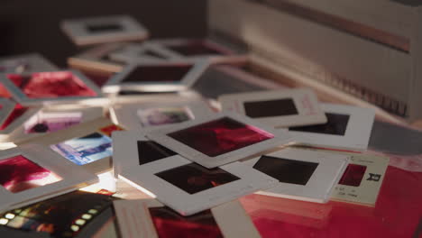 slow camera movement over a pile of colour slides