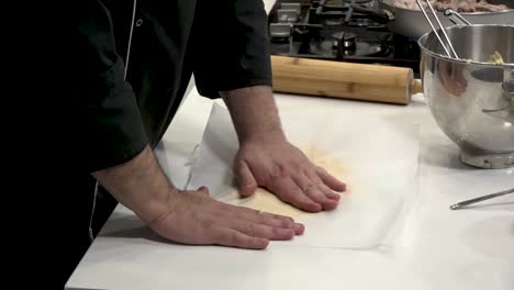 an experienced chef demonstrates precise knife skills in a sleek kitchen. fresh ingredients are prepared for a mouthwatering dish with vibrant colors and aromas.