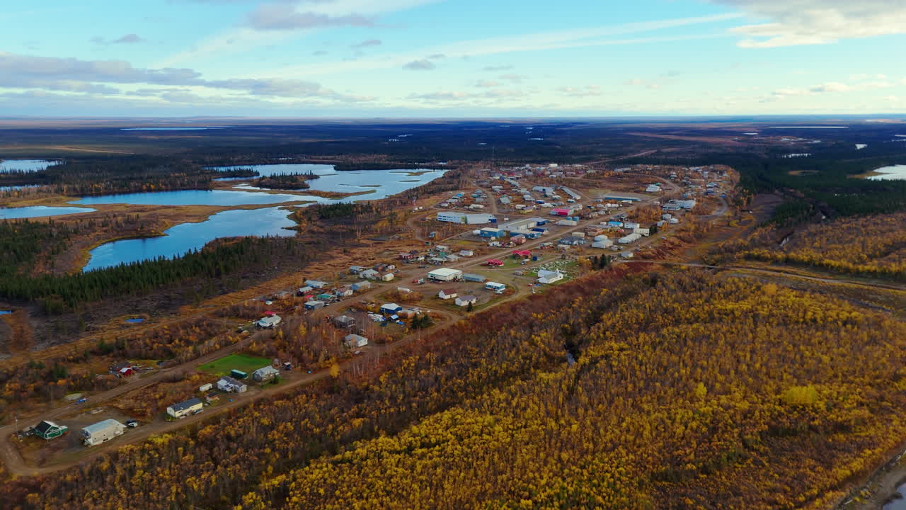 Fort McPherson Hamlet With Autumn Color Forest Nature In The Inuvik Region Of the Northwest Territories, Canada. Aerial Shot
