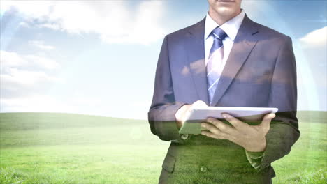 businessman using tablet computer with field overlay