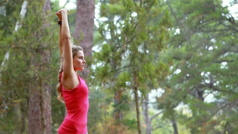 Woman-exercising-in-forest