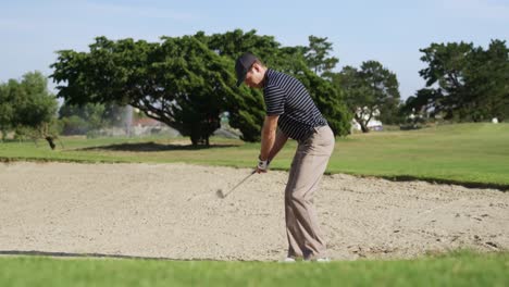 Golf-player-hitting-the-ball-with-his-club