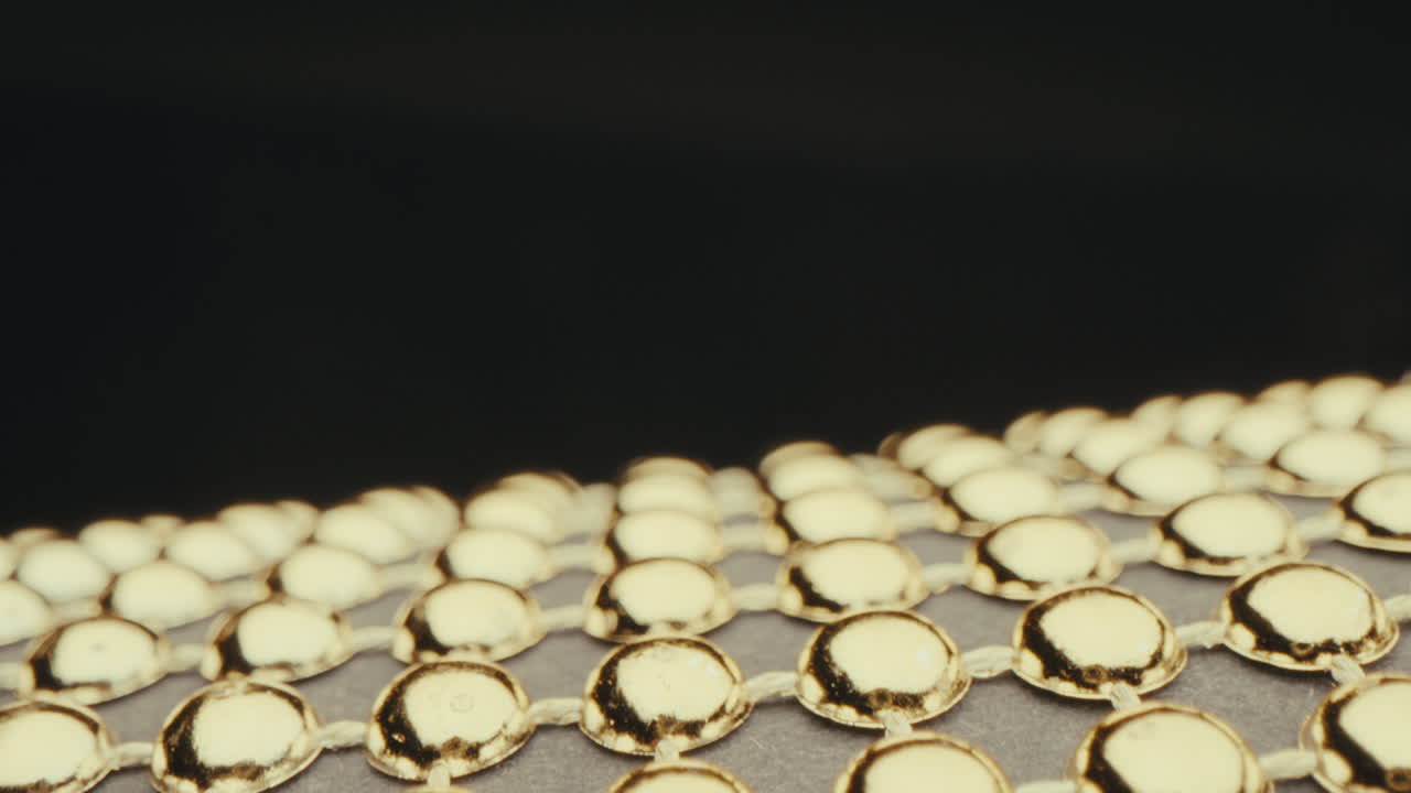 Close-up of Gold Beads on Fabric