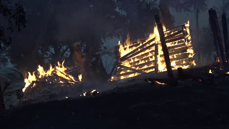 fences and outbuildings burn during a massive wildfires in australia