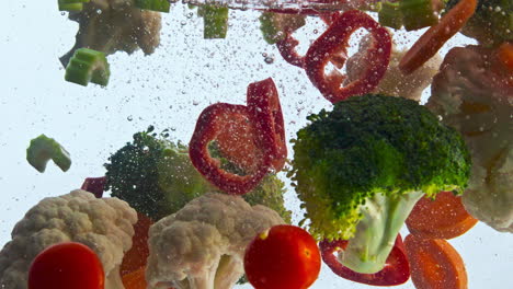 closeup fresh veggies water floating in super slow motion. organic vegetables.