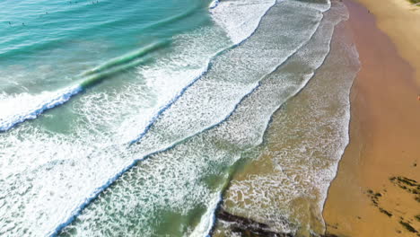 Cinematic-tilting-up-drone-shot-of-ocean-waves-crashing-at-Coffs-Harbour-Australia