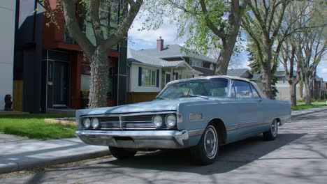 vintage car blue mercury parked on street