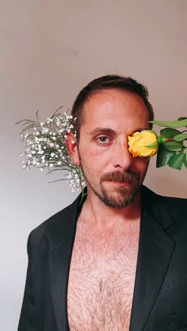 man with a yellow rose on his face