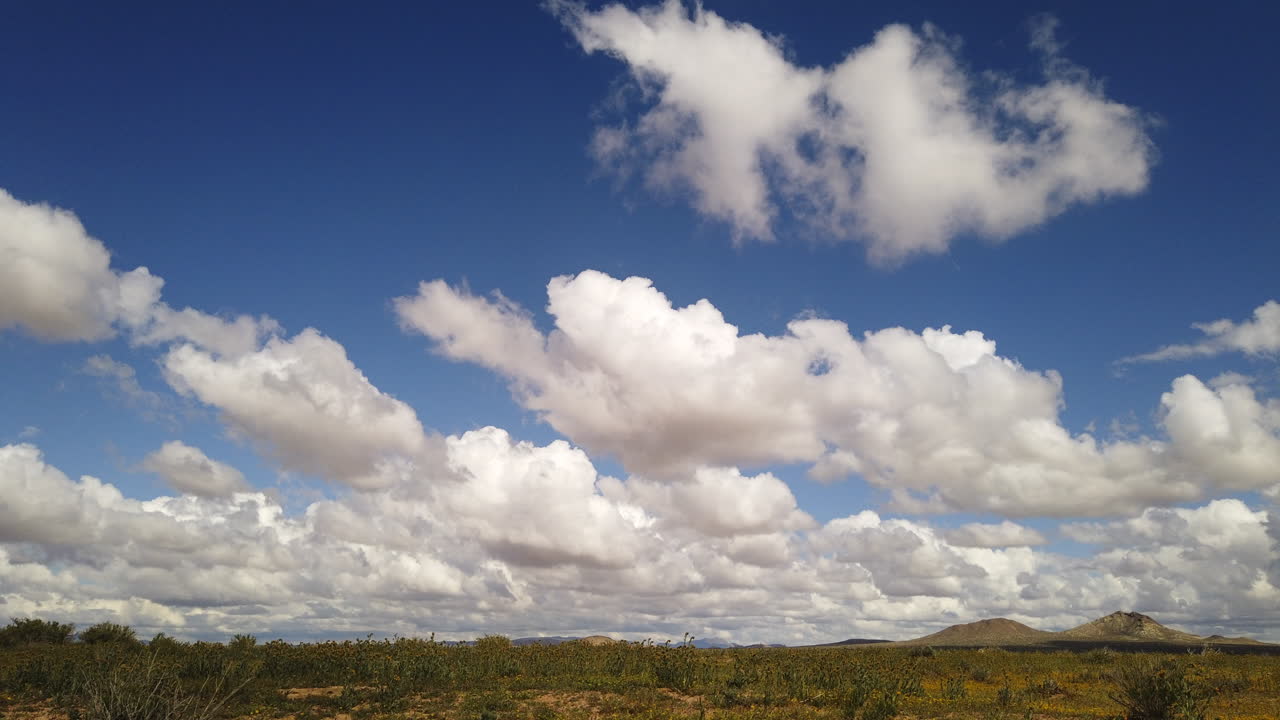 Low Cumulus White Clouds Form Over Mojave Desert, Timelapse