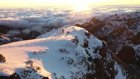 A-man-is-walking-alone-in-the-sunset-on-the-top-of-Pico-Ruivo-mountain