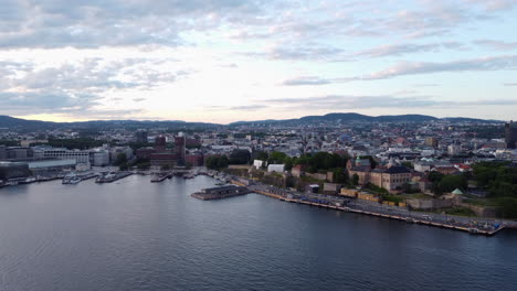 Oslo-City-and-Fjord,-Golden-Hour,-Aerial-Dolly-Out