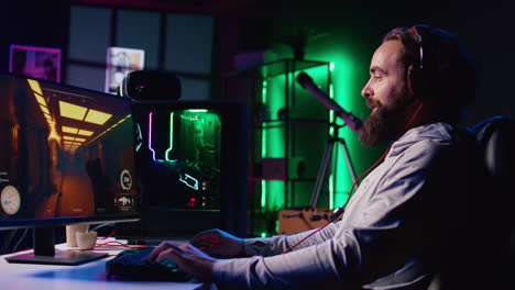 Happy-man-putting-on-headphones-to-communicate-with-teammates-online