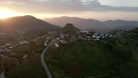 Orbit-drone-shot-with-sun-flares-above-the-mountain-in-Thailand