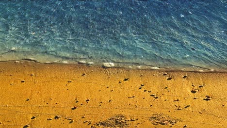 Cinemagraph-image-with-render-animation-of-floating-crystal-clear-water-at-beach-with-golden-sand