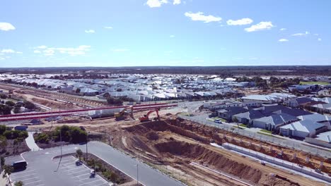 aerial rise up view over new road over rail section of santorini promenade butler part of the yanchep rail extension works