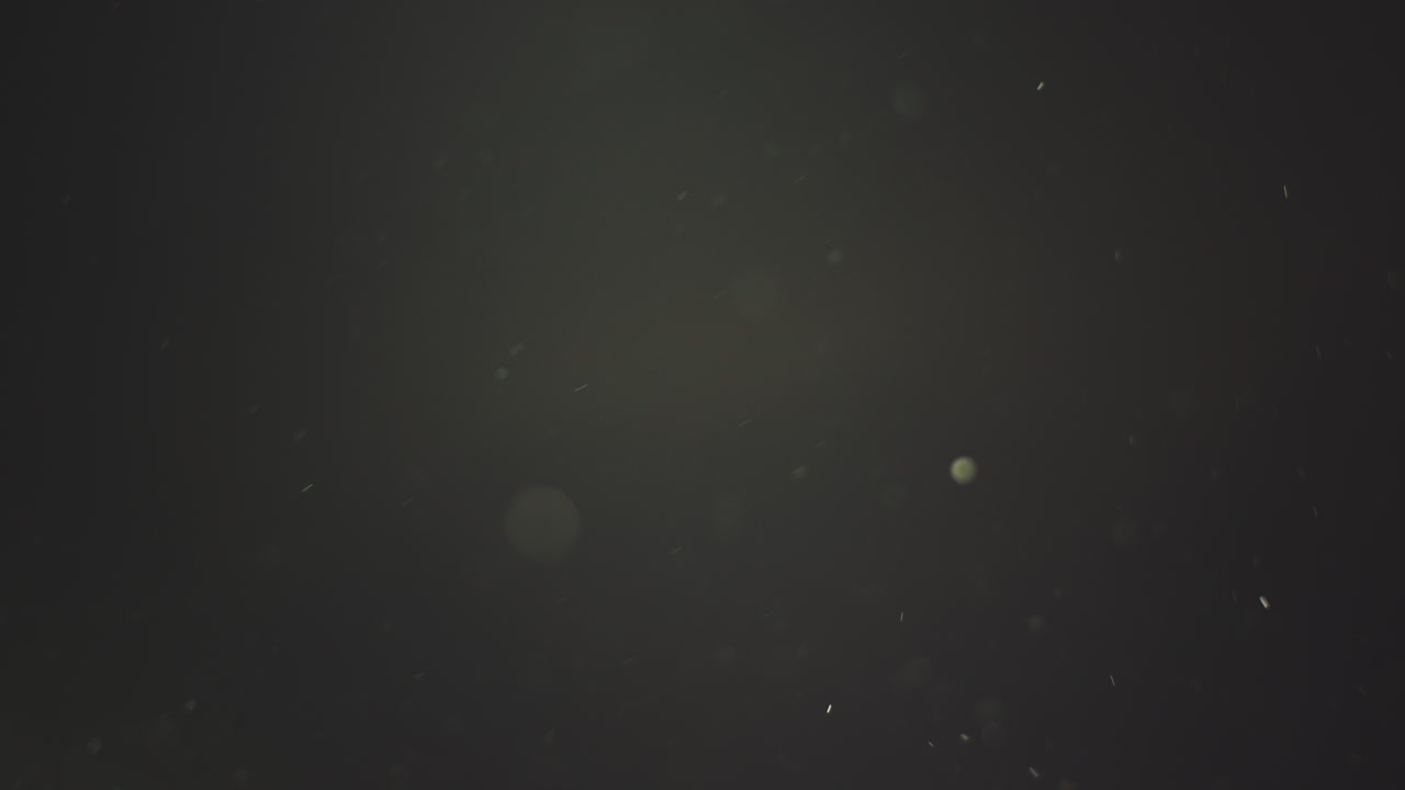 추상적인 어두운 배경과 입자 및 bokeh