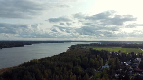 panoramic dolly out drone shot of lake tuusula in southern finland, quiet, sunny and lonely place