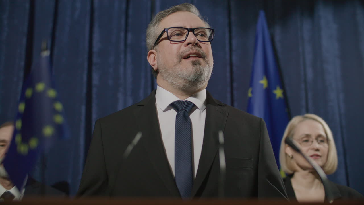 Confident European Politician Addressing Audience at Press Conference