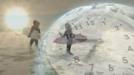 Surfers wading into ocean at sunrise, carrying boards, featuring animated clock, globe for tech ad