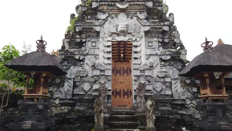 balinese ancient masceti temple entrance, old architecture in bali, indonesia, hindu art building for praying and worship, gianyar regency