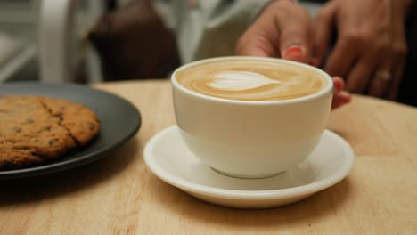 coffee and a cookie at a cafe