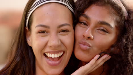 laughing joyfully, two multiracial female friends embracing friendship and happiness, at home
