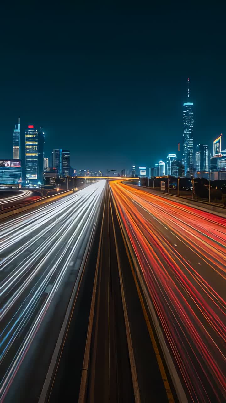 Vertical video: Starting exposure, light trails racing to city from overpass on road during commute