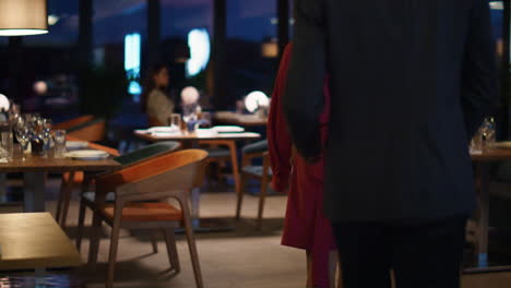 Multiethnic-couple-going-restaurant-at-evening-city.-Two-people-on-dinner-date.