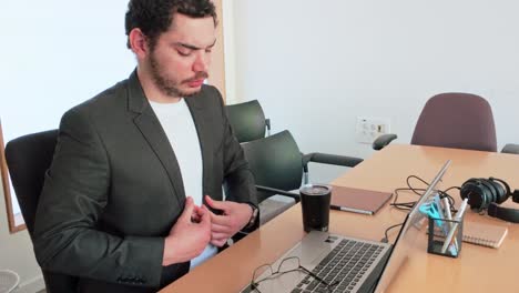 office worker takes drink at computer
