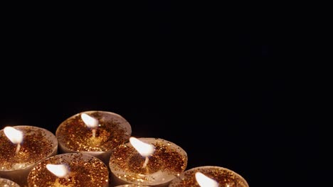 fondo de tealight taza brillantes velas luces brilla oro amarillo brillante para la celebración, la religión, el festival de aniversario