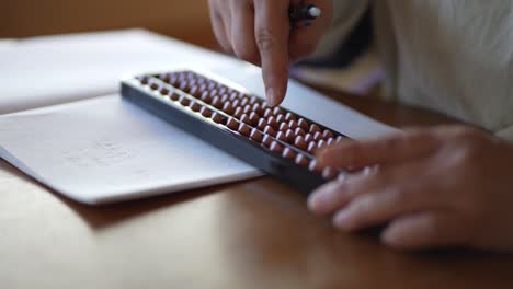 Female using abacus