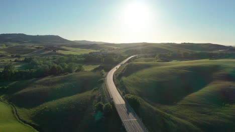 drone shot at sunset of the famous cypresses from val d'orcia in tuscany, italy