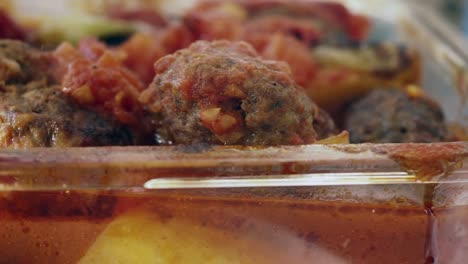 baked meatballs with potatoes and tomatoes