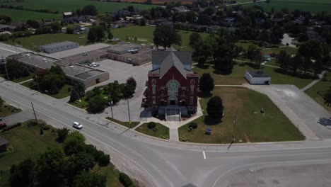 aerial 4k drone footage of church in amherstburg ontario canada surrounded by small town streets