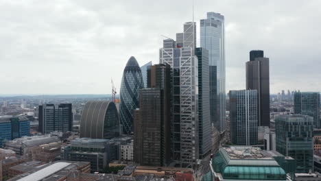 Rising-footage-of-group-of-modern-tall-business-buildings-in-City-financial-and-economic-centre.-London,-UK