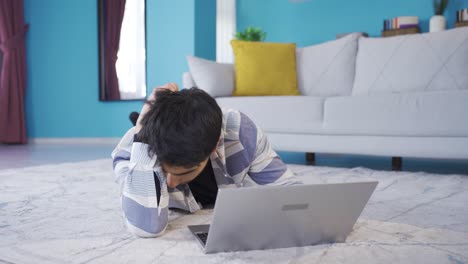 Young-man-using-laptop-gets-frustrated-and-unhappy.