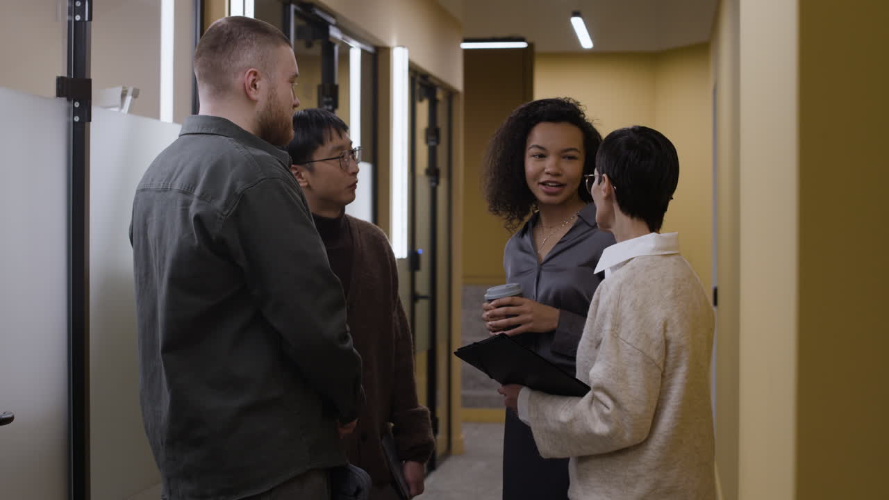 Coworkers in a Corridor Conversation