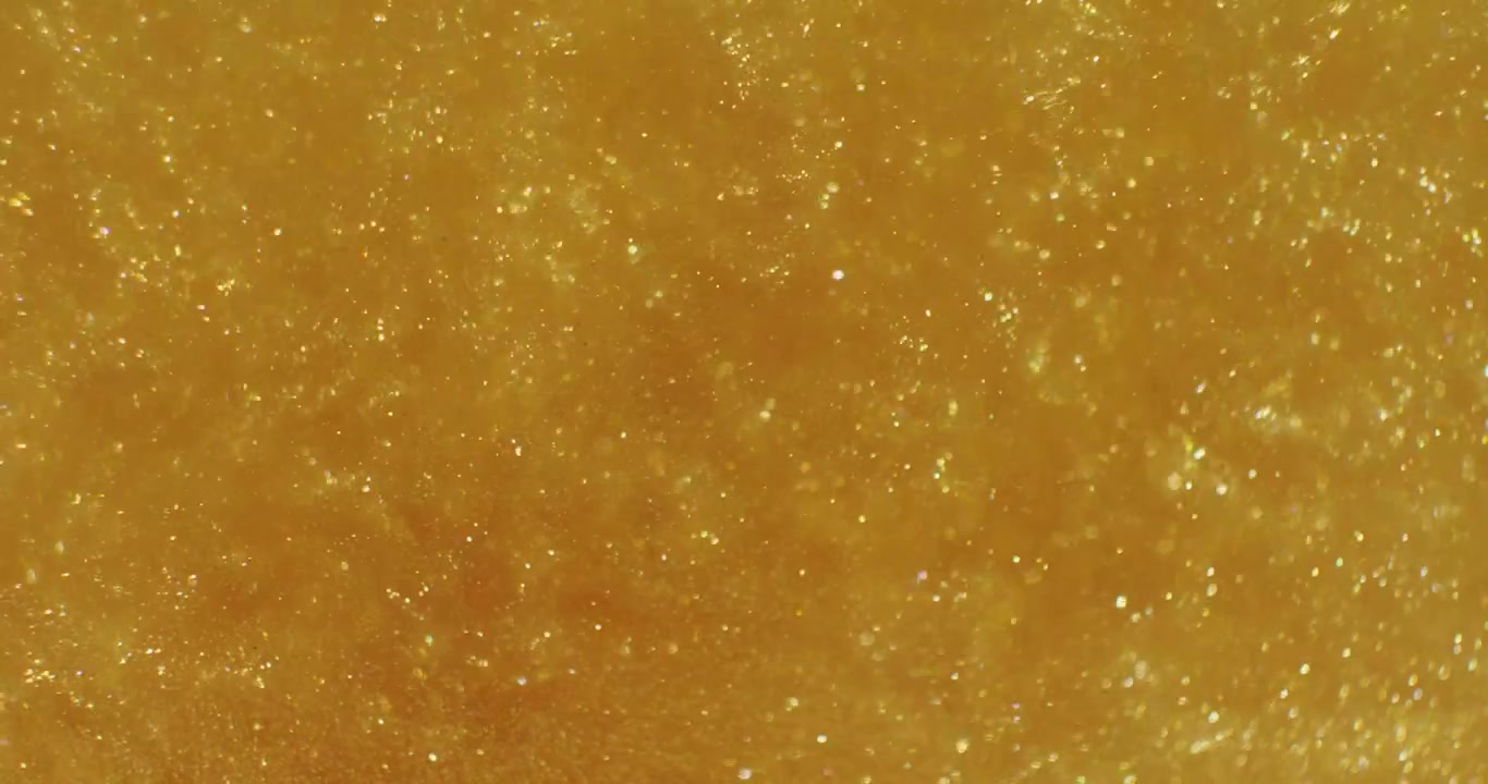 Gyllene flytande glittertextur