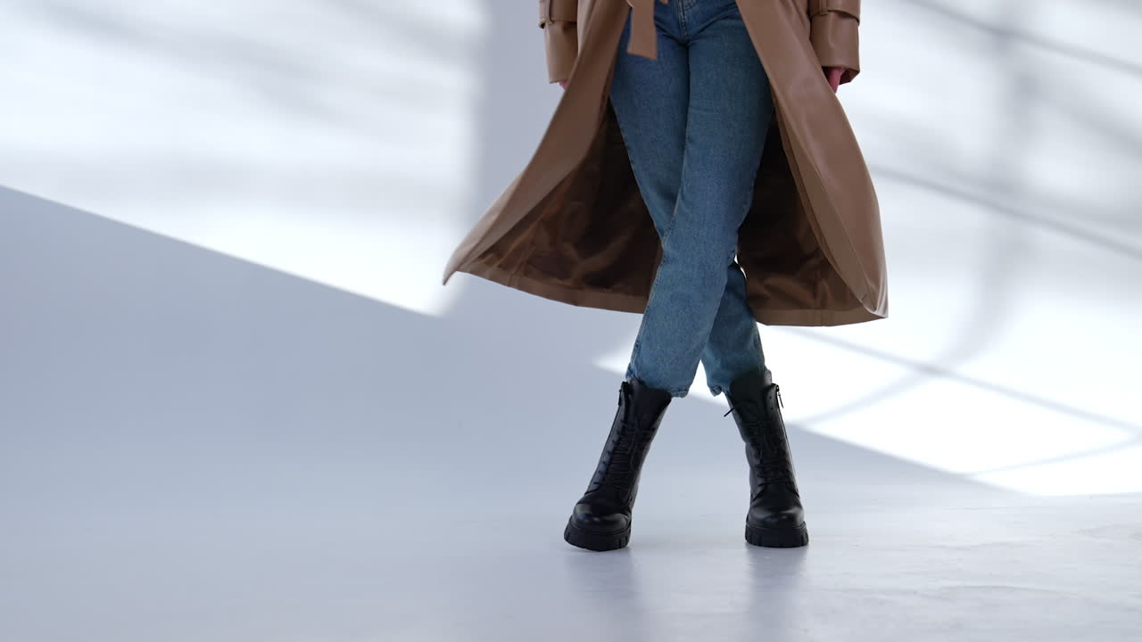 Woman in trench coat and boots